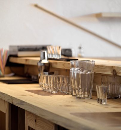 clean empty glasses on wooden bar counter